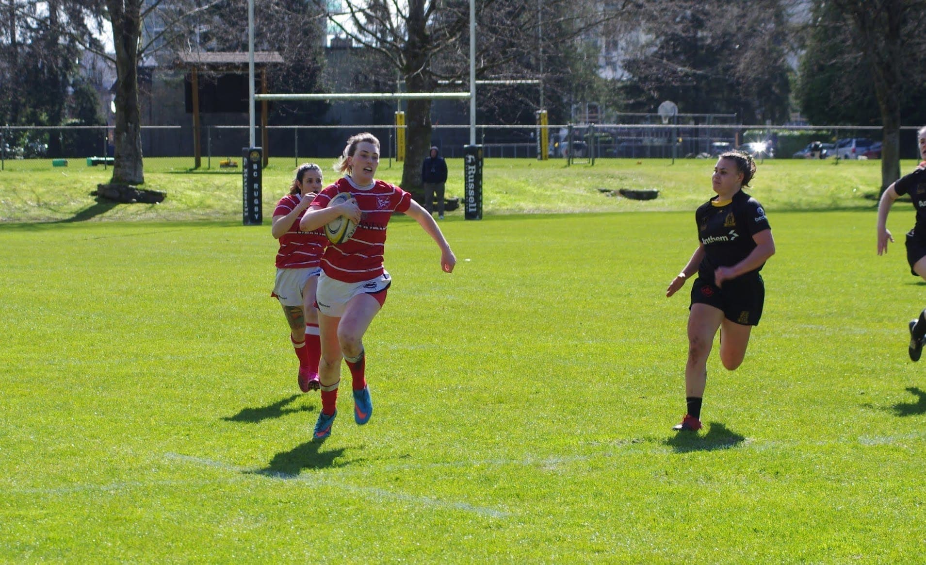 VRC Rugby player carrying the ball during a match at Brockton Oval in Stanley Park, downtown Vancouver